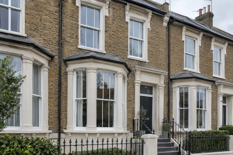 White vertical sliding sash windows on a Victorian London terrace